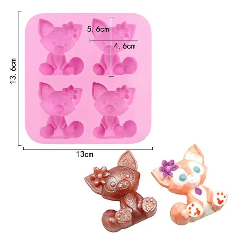 a close up of a cat shaped chocolate mold with a measuring ruler