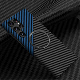 a close up of a cell phone with a blue and black carbon fiber case