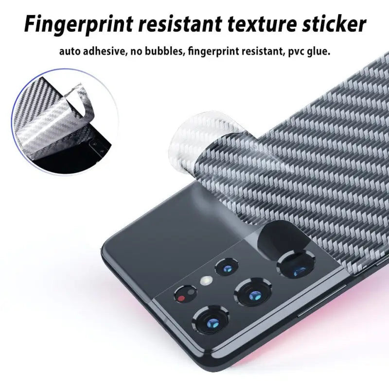 a close up of a cell phone with a carbon fiber sticker