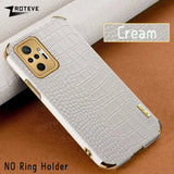 a close up of a cell phone case with a white croc pattern