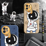 a close up of a cell phone case with an astronaut on it
