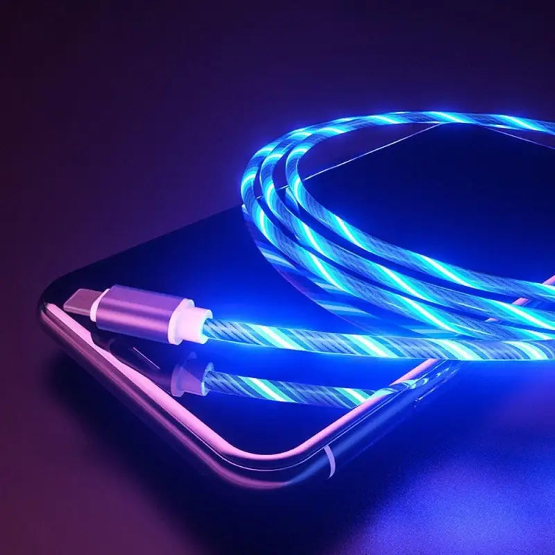 a close up of a cell phone with a glowing charging cable