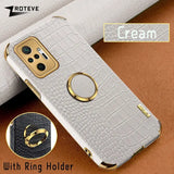 a close up of a cell phone with a ring holder