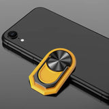 a close up of a cell phone with a ring on it