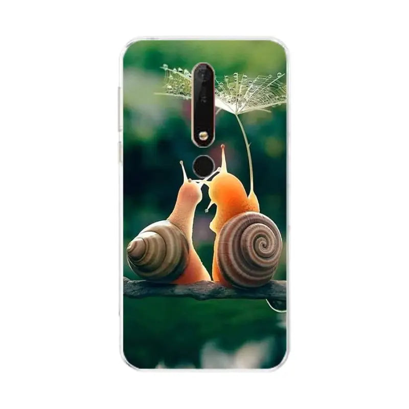 a close up of a cell phone with a snail on it