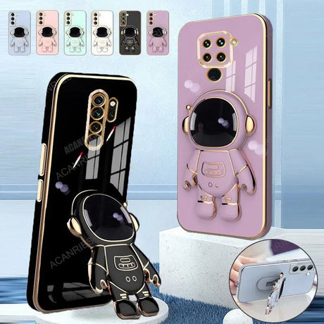 a close up of a cell phone with a spaceman on it