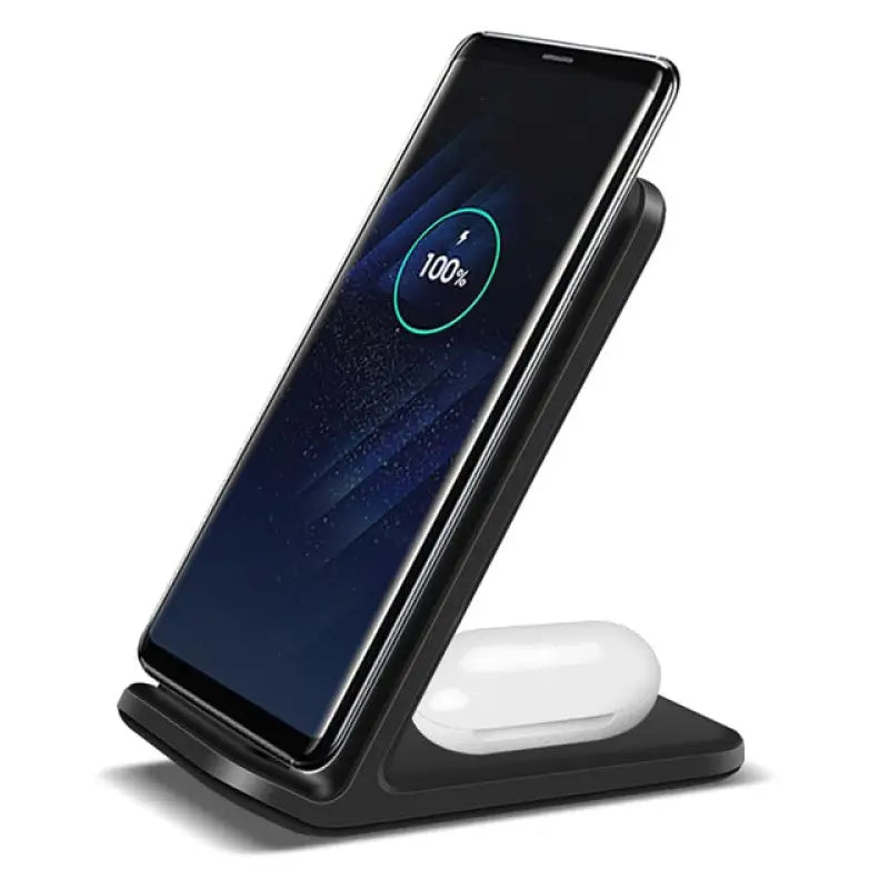 a close up of a cell phone on a charging stand