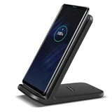 a close up of a cell phone on a stand with a battery