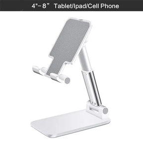 a white table top with a white phone holder