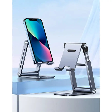 a close up of a cell phone on a stand on a table