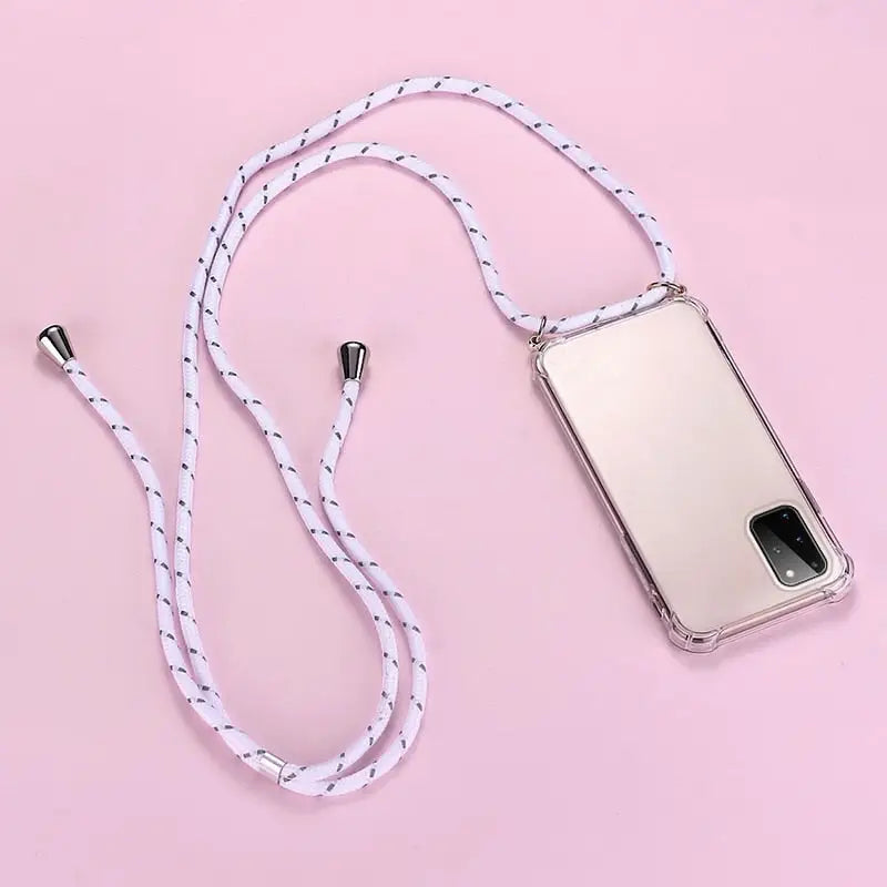 there is a cell phone with a white cord attached to it