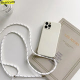 there is a white phone case with a white cord attached to it