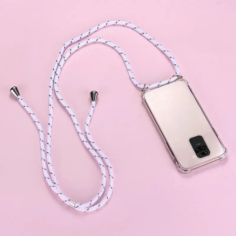 there is a cell phone with a white cord attached to it