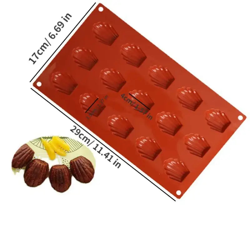 a close up of a chocolate mold with a chocolate molder and a piece of fruit