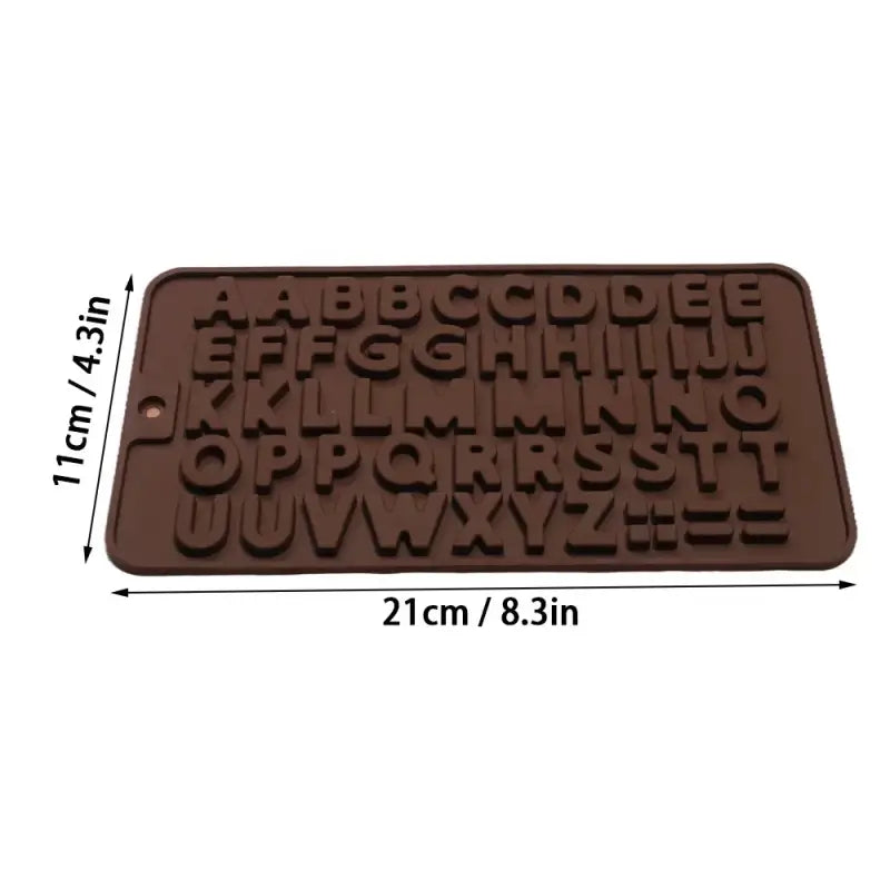 a close up of a chocolate mould with the letters of the alphabet