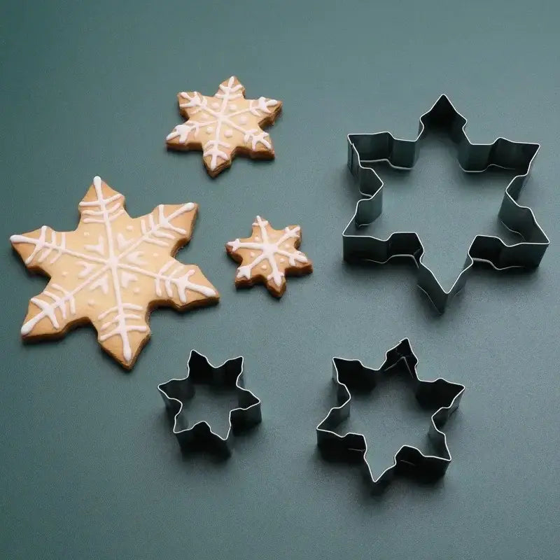 a close up of a cookie cutter and cookie cutters on a table