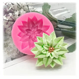 a close up of a flower shaped cake mold with a flower on top
