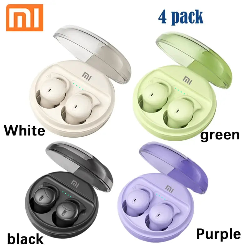 a close up of four different colors of earphones in a case