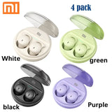 a close up of four different colors of earphones in a case