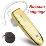 a close up of a gold earphone with a red bag