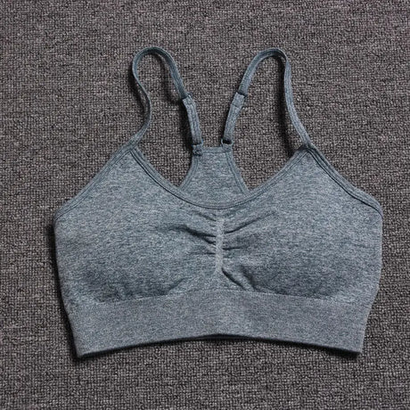 a close up of a gray bra top on a carpet