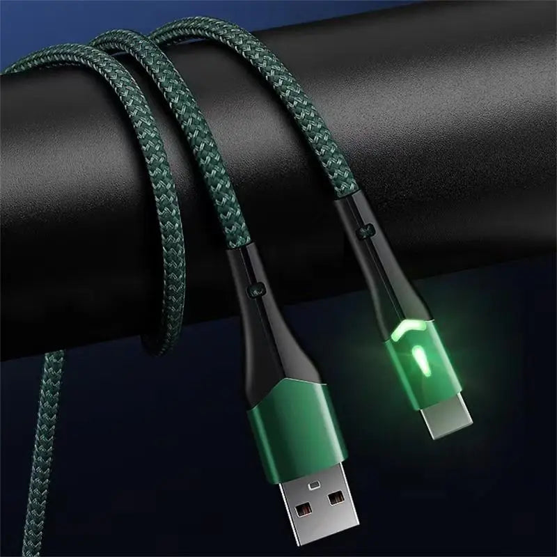 a close up of a green usb cable connected to a black cable