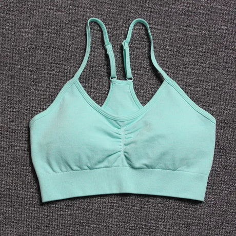 a close up of a green bra top on a carpet