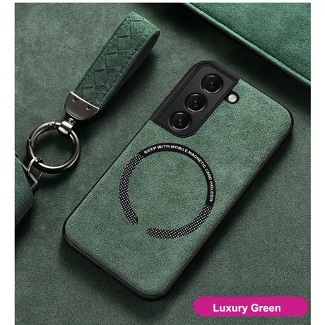 A close up of a green phone case with a keychain