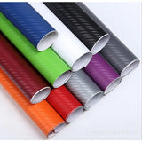 a close up of a group of different colored rolls of carbon fiber