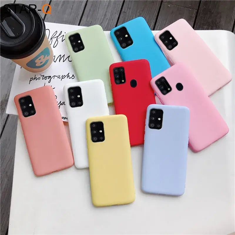 a close up of a group of different colored cases on a table