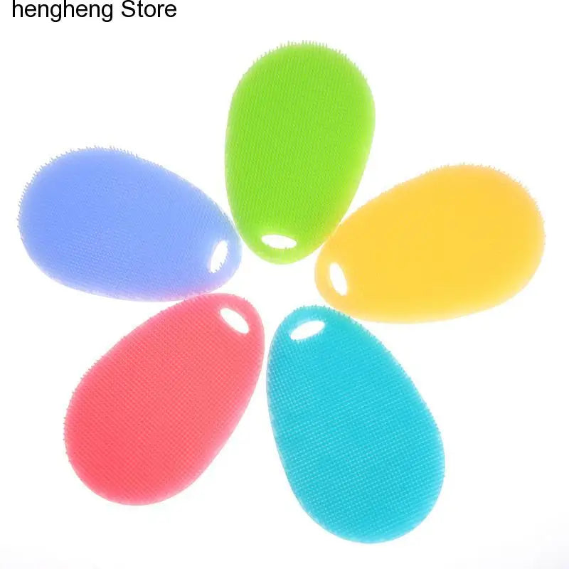 a set of four colorful plastic sponges
