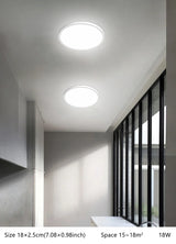 a close up of a kitchen with a white counter and a ceiling light