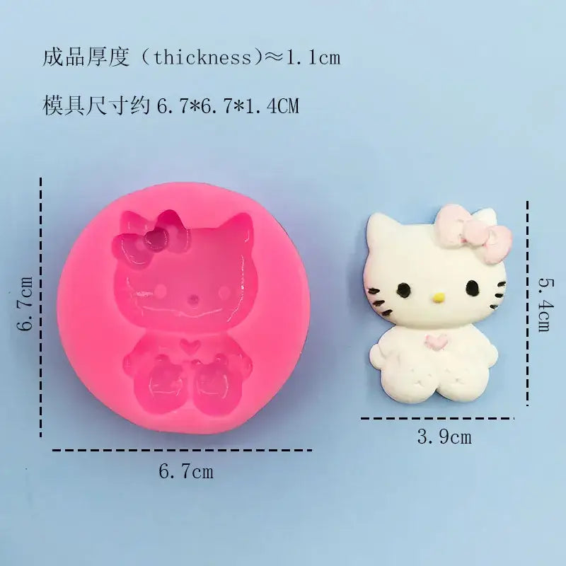 a close up of a hello kitty mold with a pink mold