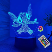 A close up of a lamp with a remote on a table
