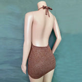 a woman in a brown swimsuit with a brown bow