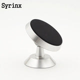 a round metal knob with a black surface
