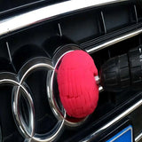 a red ball is on the hood of a car