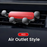 a close up of a red air outlet style device mounted on a car