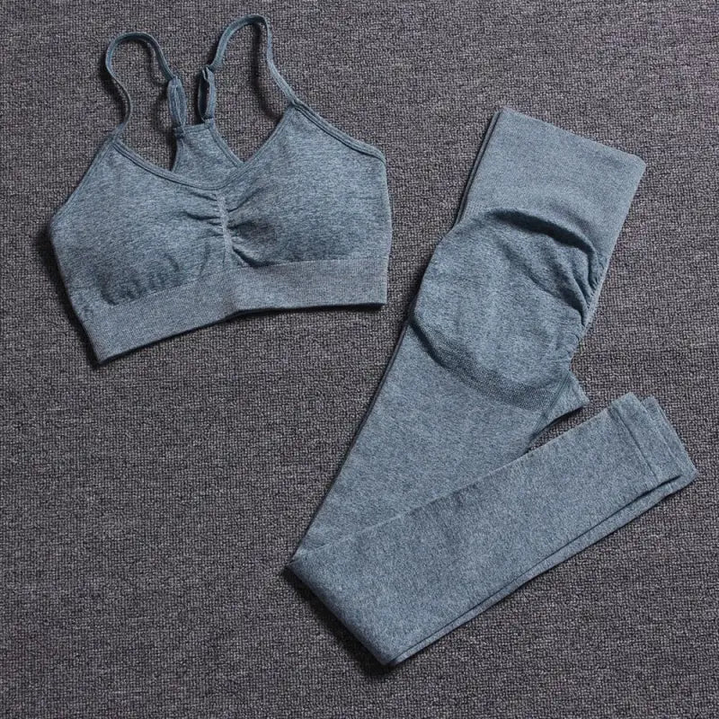 a pair of grey sports bras and leggings