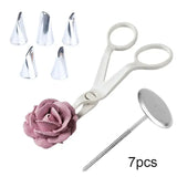 a close up of a pair of scissors and a flower