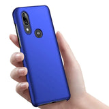 a close up of a person holding a blue motorola moto g7