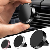 a close up of a person holding a cell phone in a car