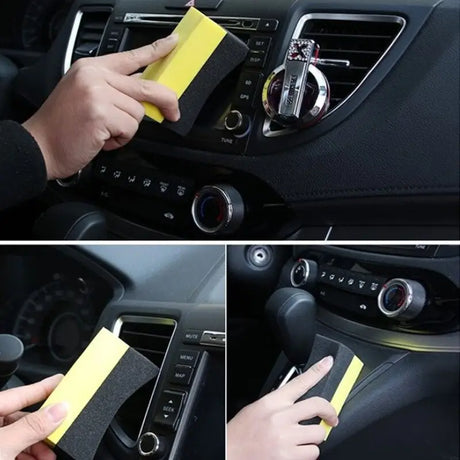 a person cleaning a car with a sponge