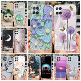 a close up of a person holding a cell phone with a bunch of different designs