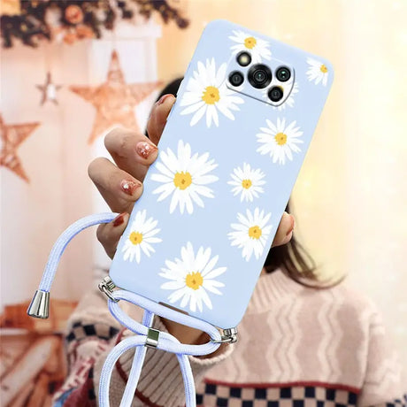 there is a woman holding a phone with a flower design on it