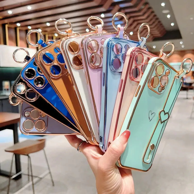 a hand holding a phone case with a bunch of keys