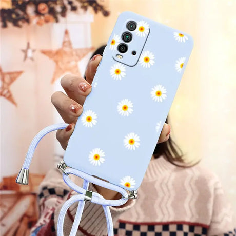 there is a woman holding a phone with a daisy pattern on it