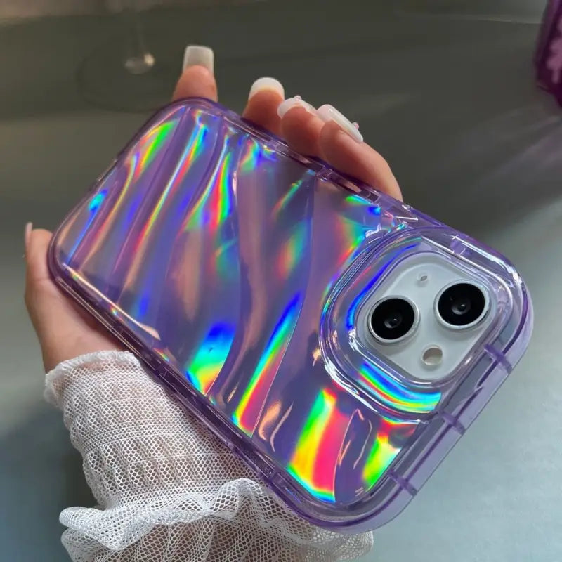 someone holding a phone case with a holographic design
