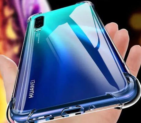 a close up of a person holding a phone with a blue back