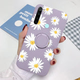 someone holding a purple phone with a white flower on it